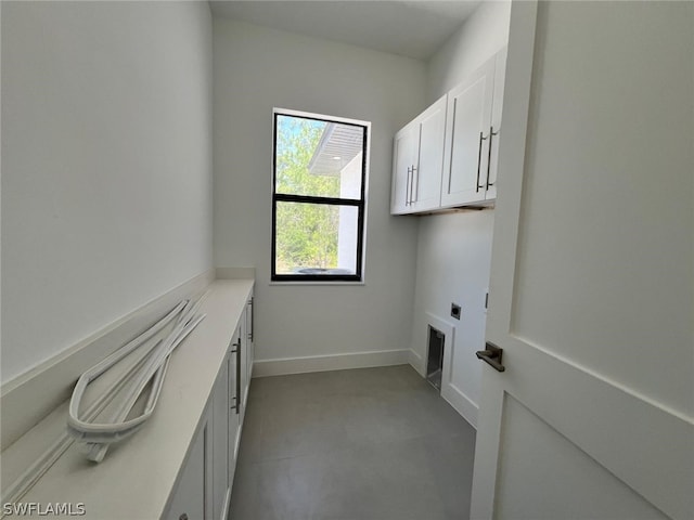 washroom with cabinets and electric dryer hookup