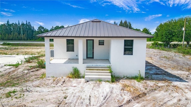 view of front of house with a porch and a water view