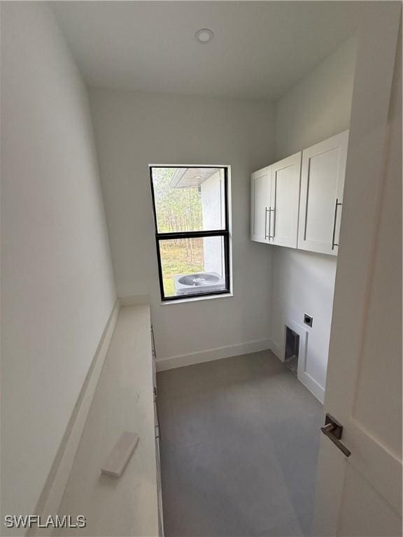 laundry room featuring cabinets and electric dryer hookup