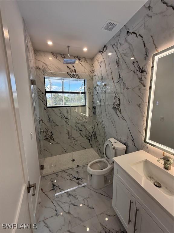 bathroom featuring walk in shower, vanity, and toilet