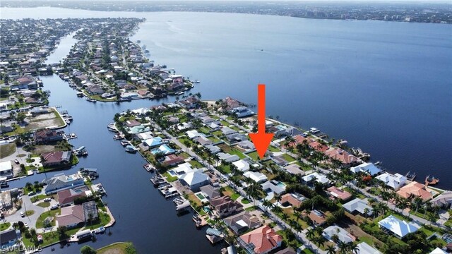 aerial view featuring a residential view and a water view