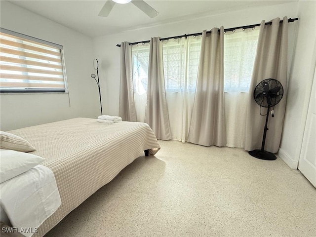 bedroom featuring a ceiling fan and speckled floor