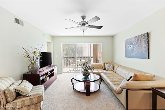 living room with carpet floors and ceiling fan