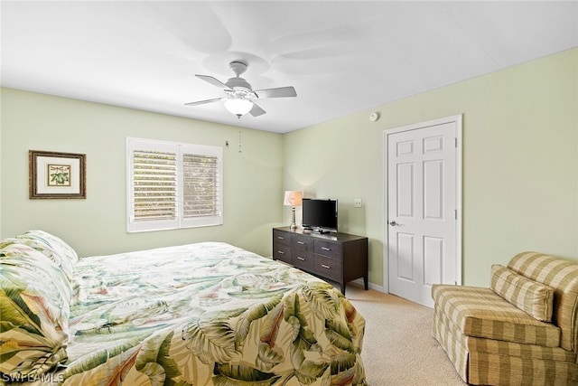 bedroom with light carpet and ceiling fan