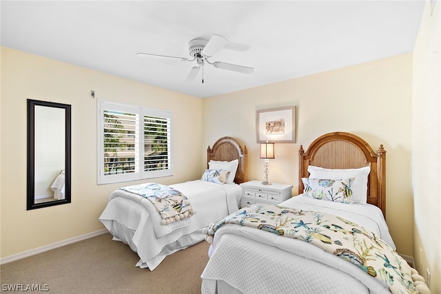 bedroom with ceiling fan and carpet