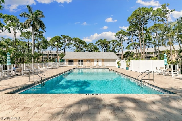 view of swimming pool featuring a patio