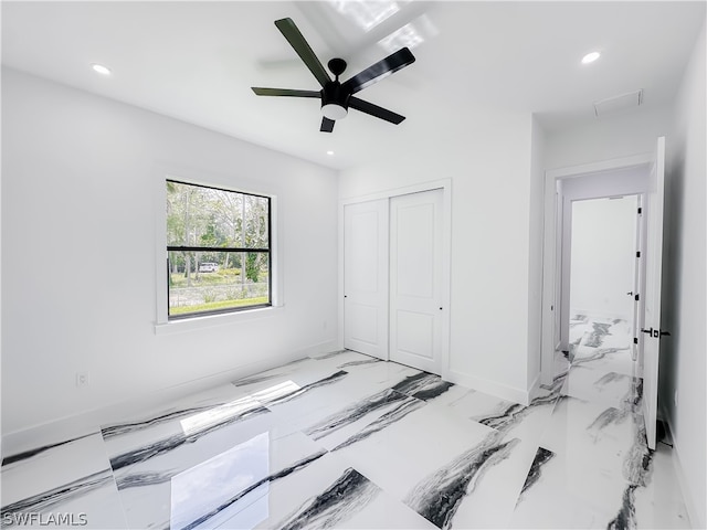 bedroom featuring ceiling fan and a closet