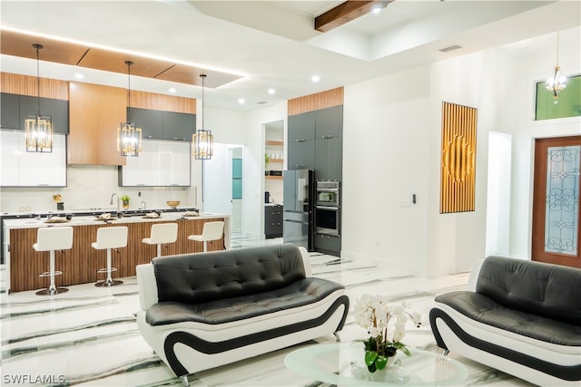 living room featuring beamed ceiling