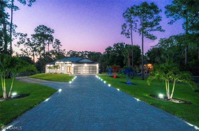 ranch-style home featuring a lawn