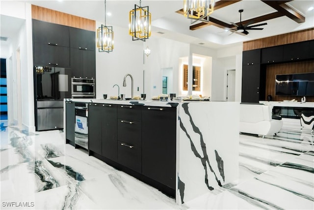 kitchen with appliances with stainless steel finishes, ceiling fan, sink, beam ceiling, and hanging light fixtures