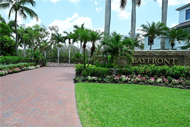 community sign featuring a lawn