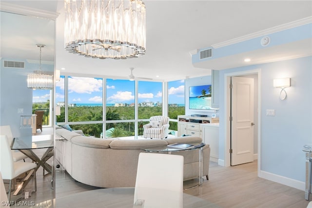 living room featuring ceiling fan with notable chandelier, light hardwood / wood-style flooring, and crown molding