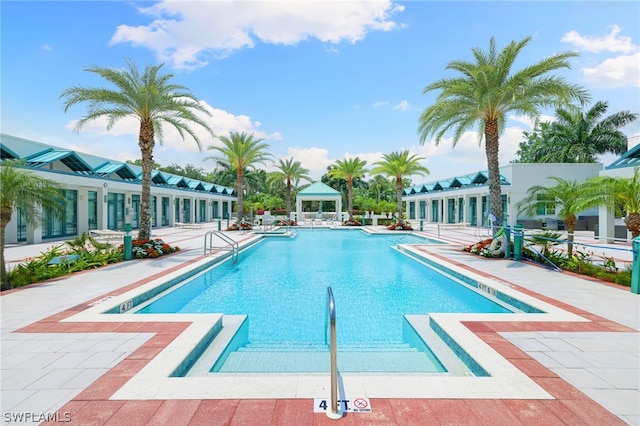 view of swimming pool with a patio