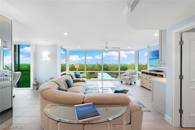 living room featuring a wall of windows and ceiling fan