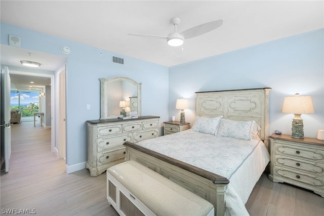 bedroom featuring ceiling fan and light hardwood / wood-style floors