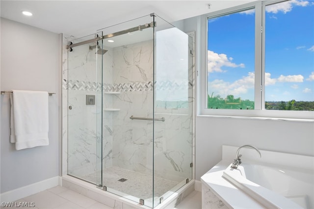 bathroom featuring independent shower and bath