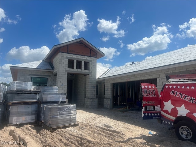 view of front of house featuring cooling unit