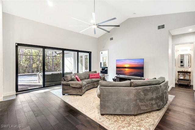 living room with ceiling fan, high vaulted ceiling, and dark hardwood / wood-style flooring