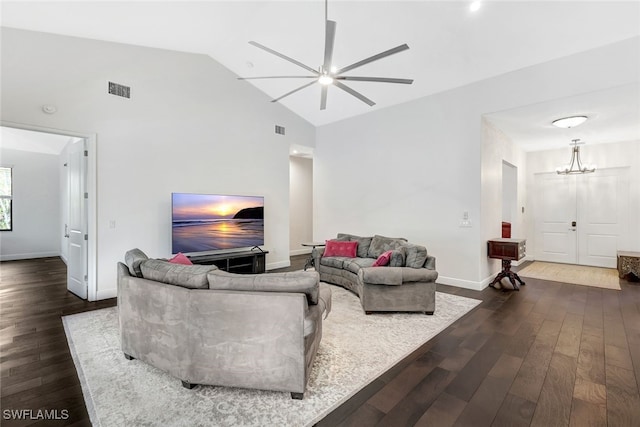 living room featuring ceiling fan with notable chandelier, high vaulted ceiling, and dark hardwood / wood-style floors