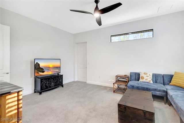 carpeted living room featuring ceiling fan