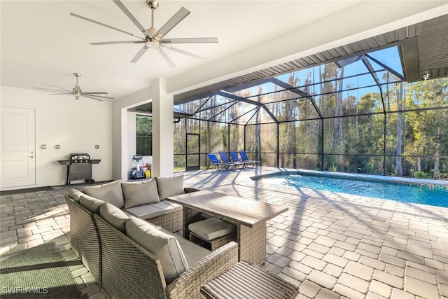 view of pool with an outdoor hangout area, a patio, and a lanai