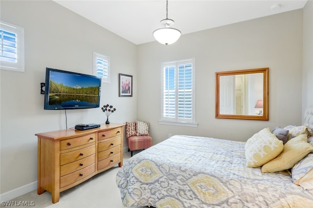 bedroom with light colored carpet