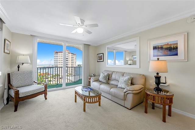 living room with a view of city, a ceiling fan, crown molding, and light colored carpet