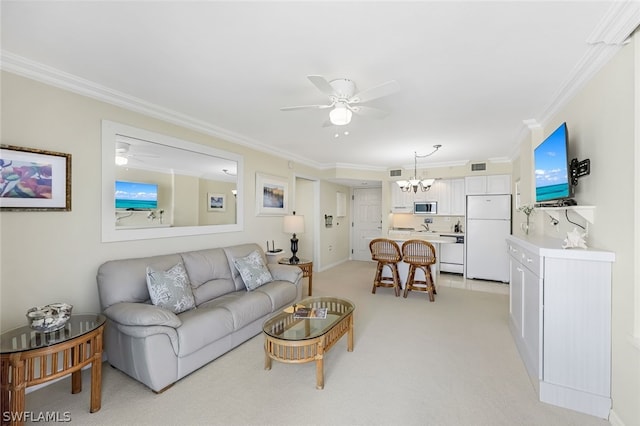 living area featuring ceiling fan with notable chandelier, visible vents, light colored carpet, and crown molding