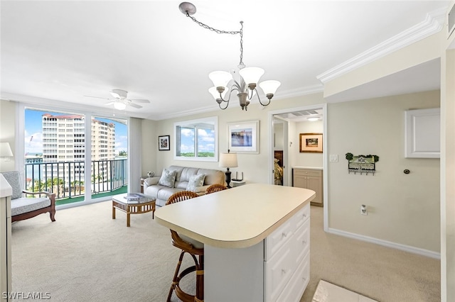 kitchen with open floor plan, light countertops, light colored carpet, and white cabinets