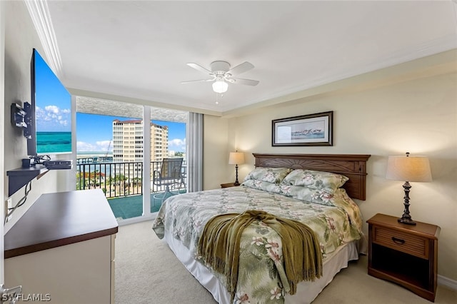 bedroom with light carpet, a ceiling fan, access to outside, a wall of windows, and crown molding