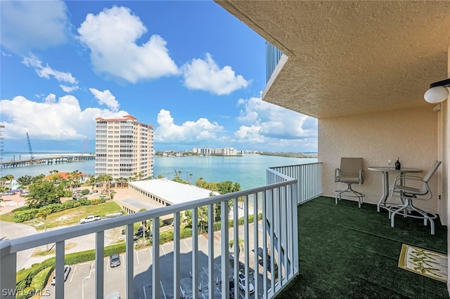 balcony featuring a water view