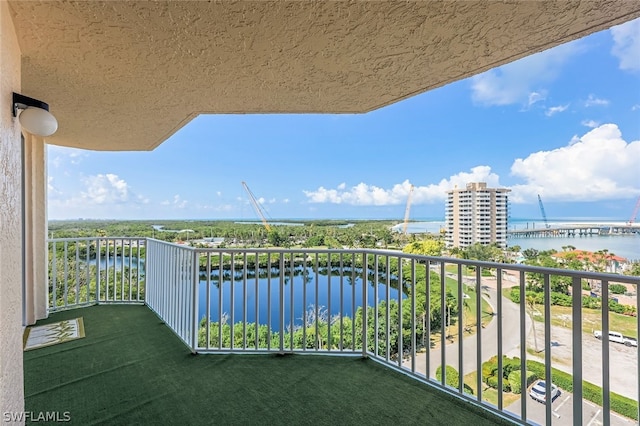 balcony featuring a water view