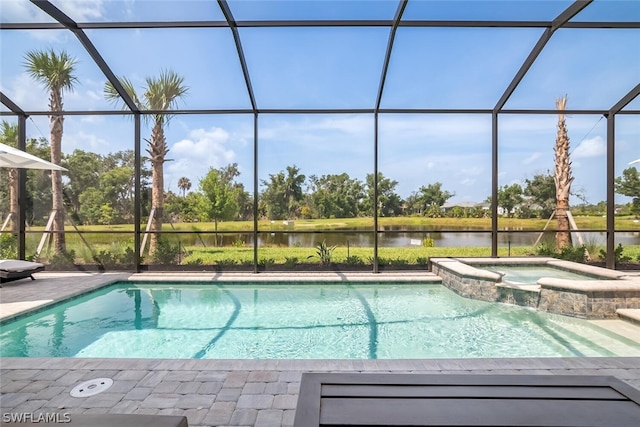 view of pool featuring glass enclosure, an in ground hot tub, and a water view