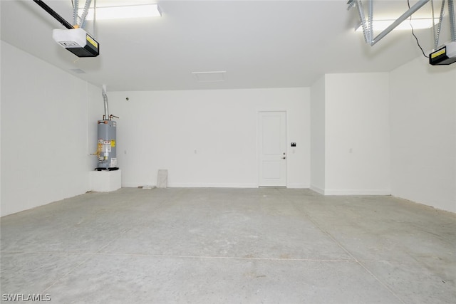 garage with a garage door opener and gas water heater