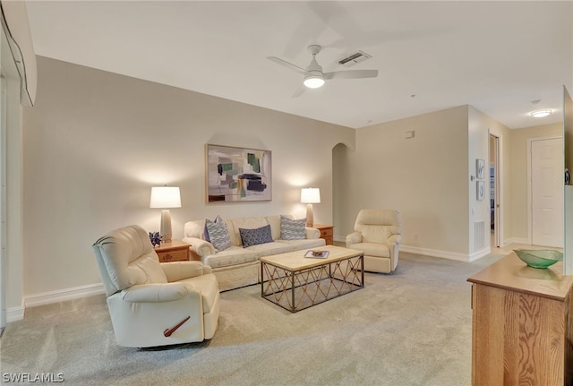 living room featuring carpet and ceiling fan