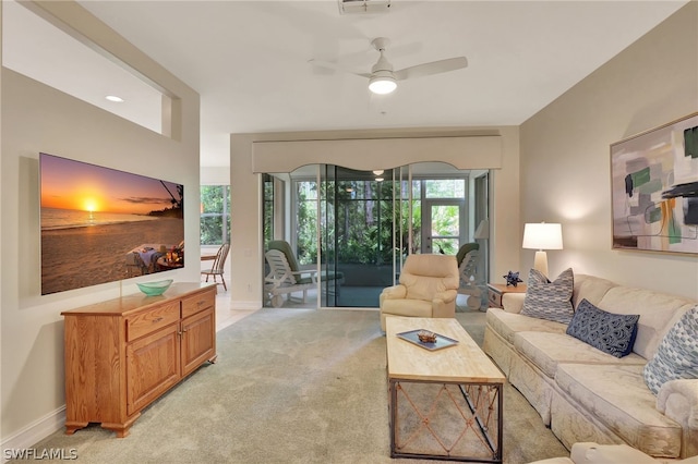 living room featuring light carpet and ceiling fan