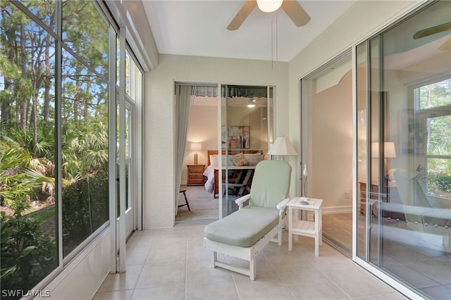 sunroom with a ceiling fan