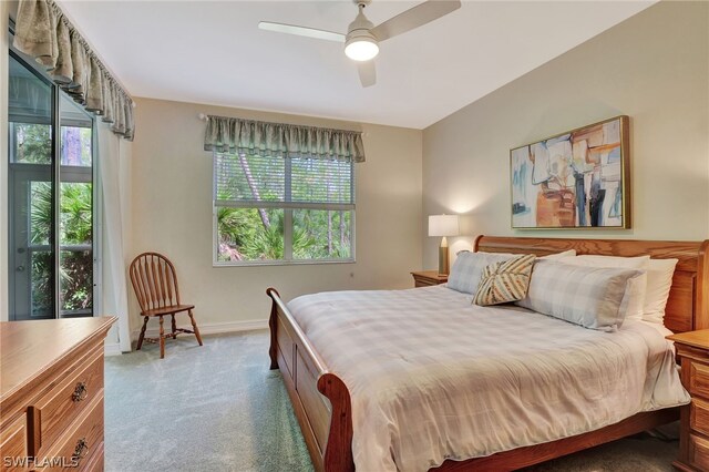 bedroom with light carpet and ceiling fan