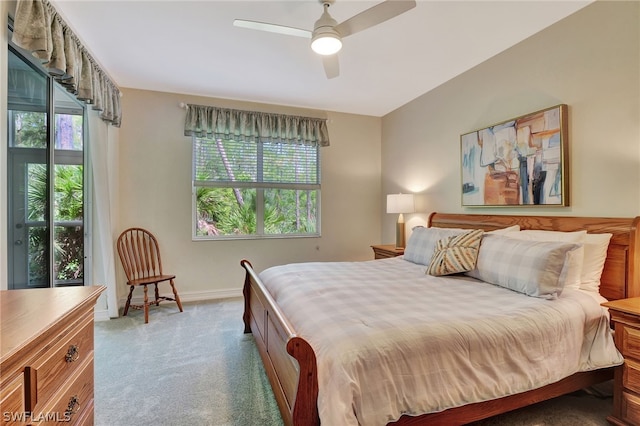 bedroom featuring carpet floors, baseboards, and a ceiling fan