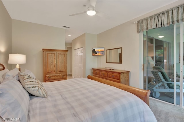 bedroom featuring access to exterior, a closet, visible vents, carpet flooring, and ceiling fan