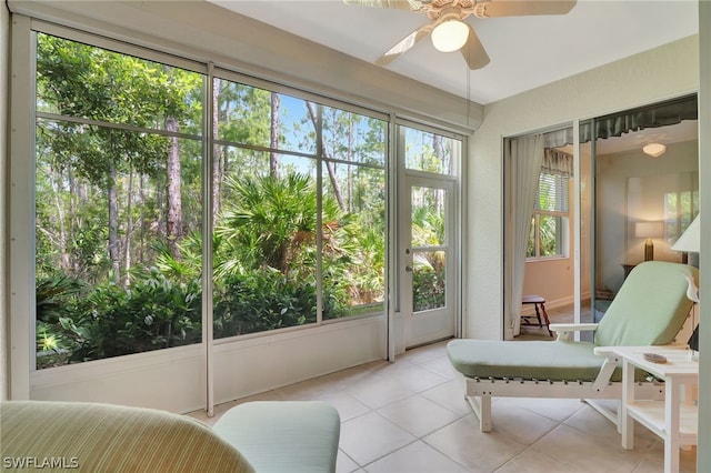 sunroom featuring a wealth of natural light and ceiling fan