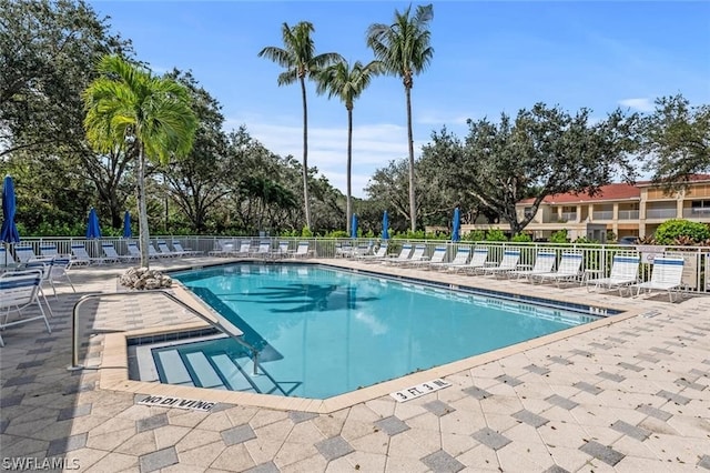 view of swimming pool with a patio area