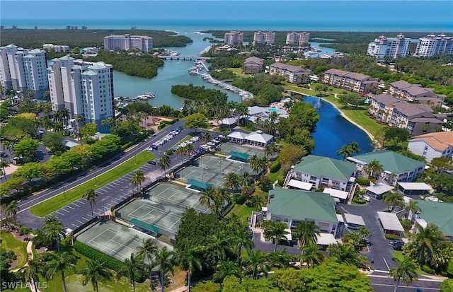 birds eye view of property with a water view