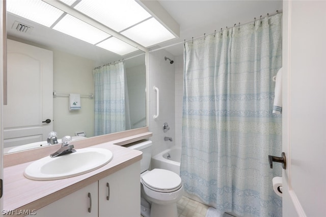 full bathroom with vanity, toilet, and shower / bath combo with shower curtain