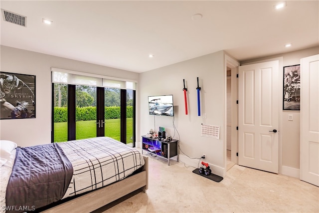 tiled bedroom featuring access to outside