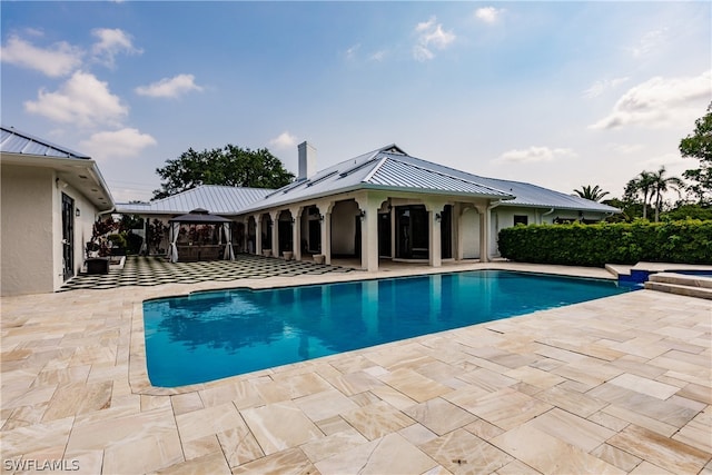 view of swimming pool featuring a patio