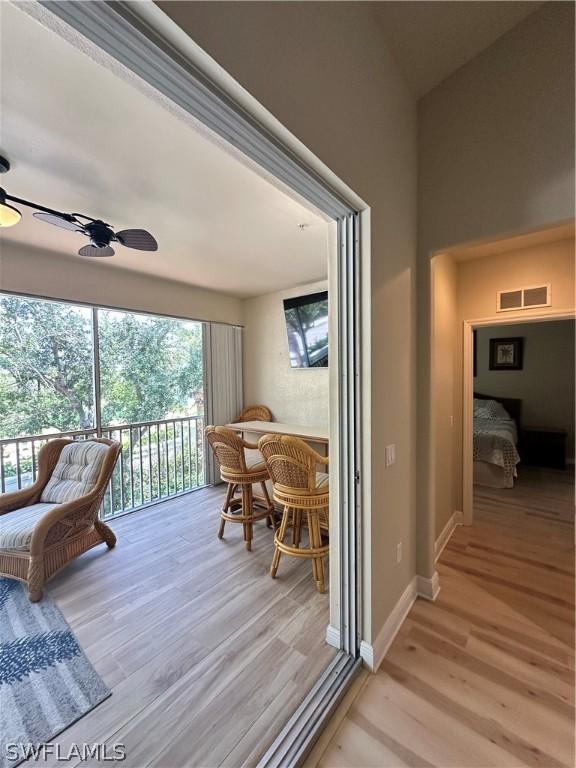 interior space with ceiling fan