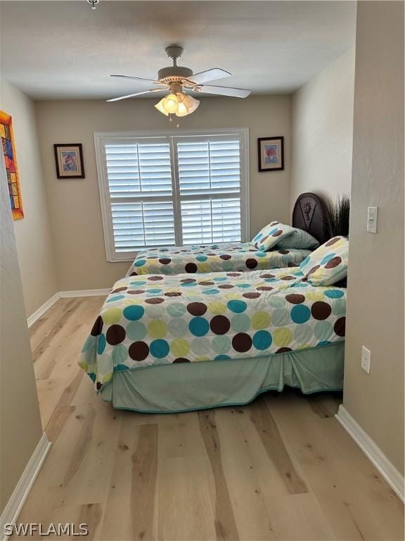 bedroom featuring ceiling fan and light hardwood / wood-style floors