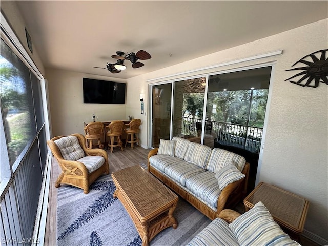 sunroom / solarium with ceiling fan