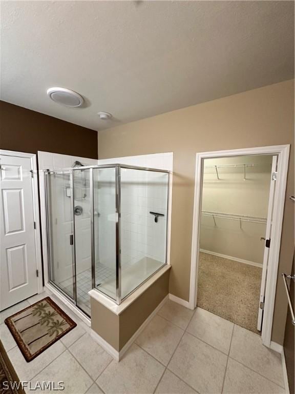 bathroom featuring tile patterned floors and walk in shower